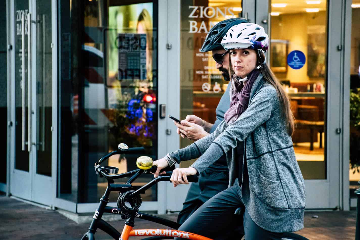 woman riding bike with helmet