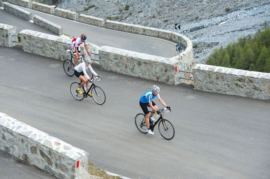 Men cycling up hill - aerobic endurance