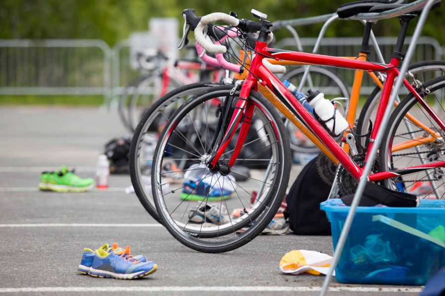 Road bikes for triathlon with shoes and water bottles attached