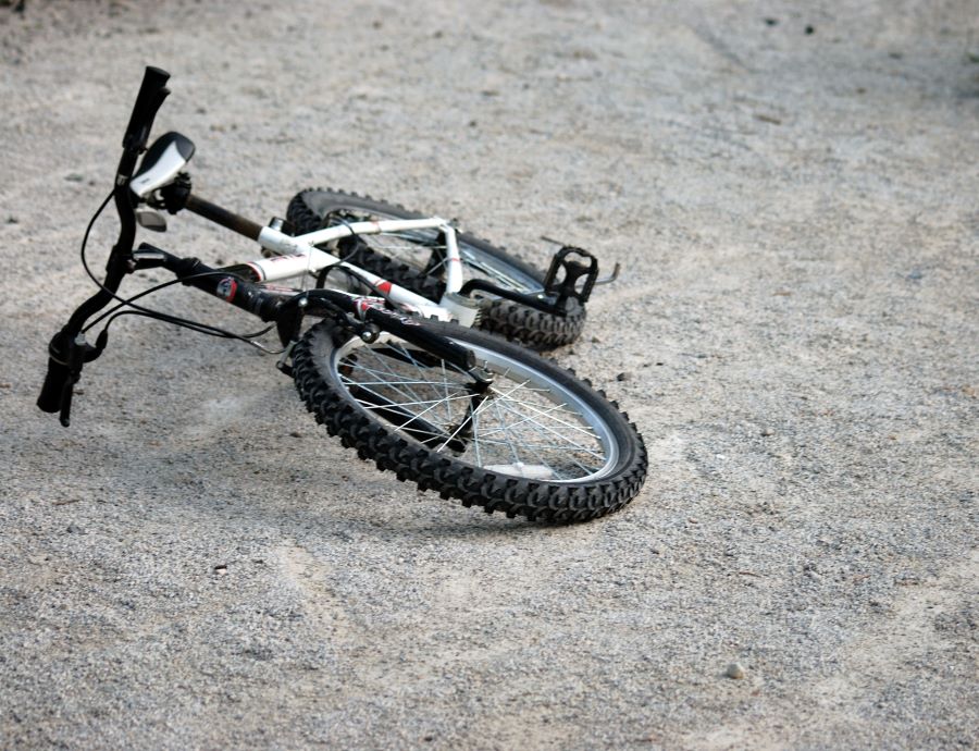 BMX bike lying on its side on the road