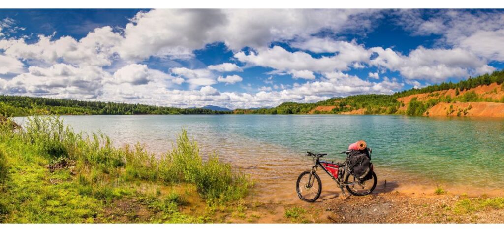 Touring bike next to a lake