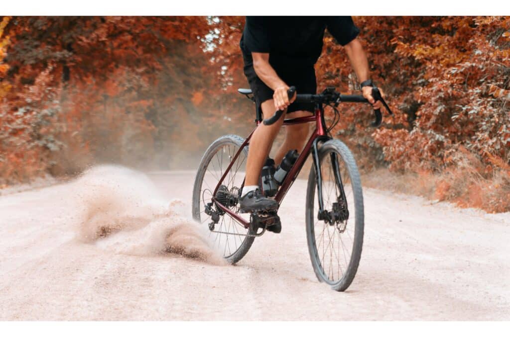 Gravel bike riding at speed on gravel surface